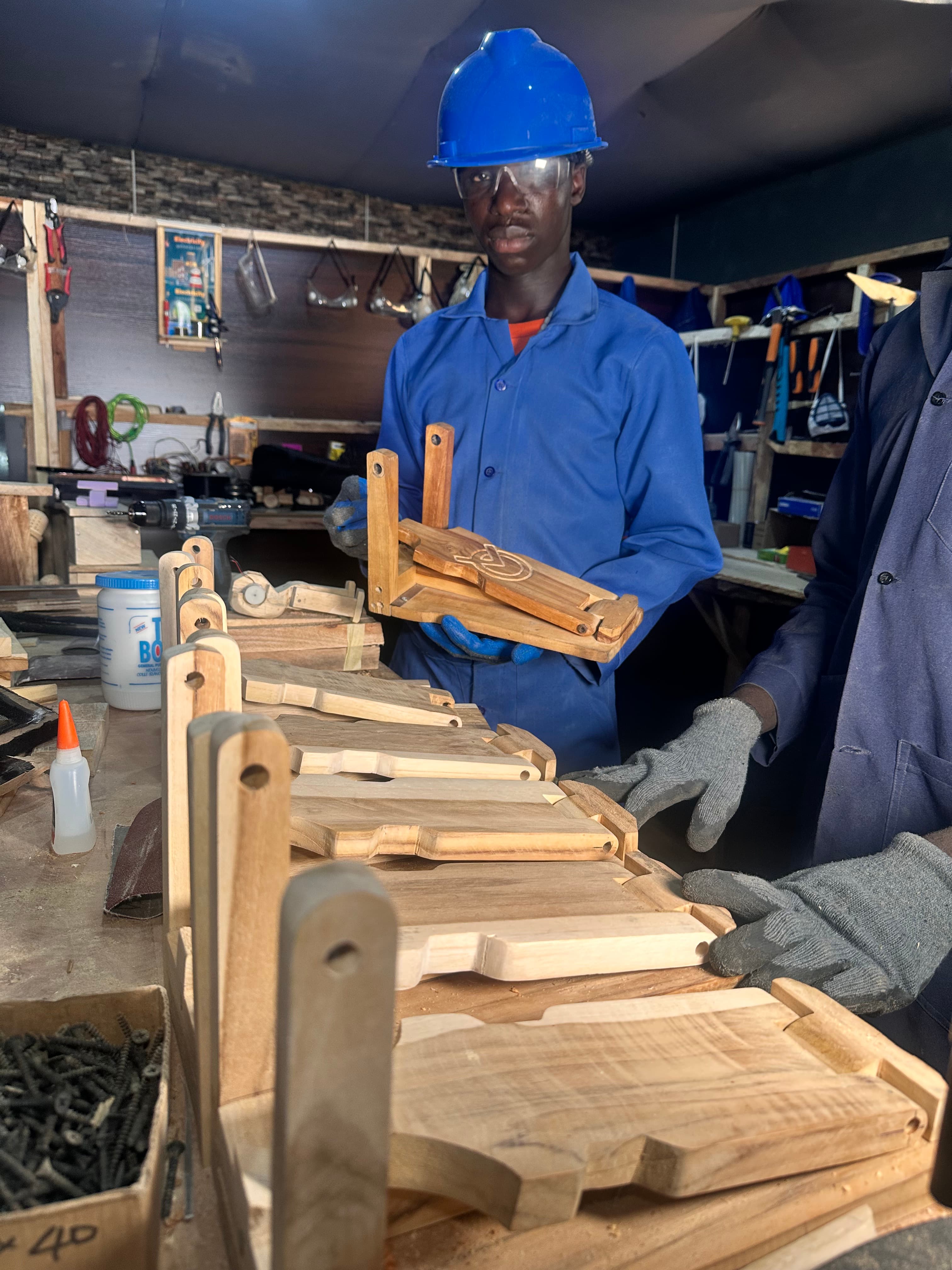 Ezekiel Bulus with wooden drum pedals he built
